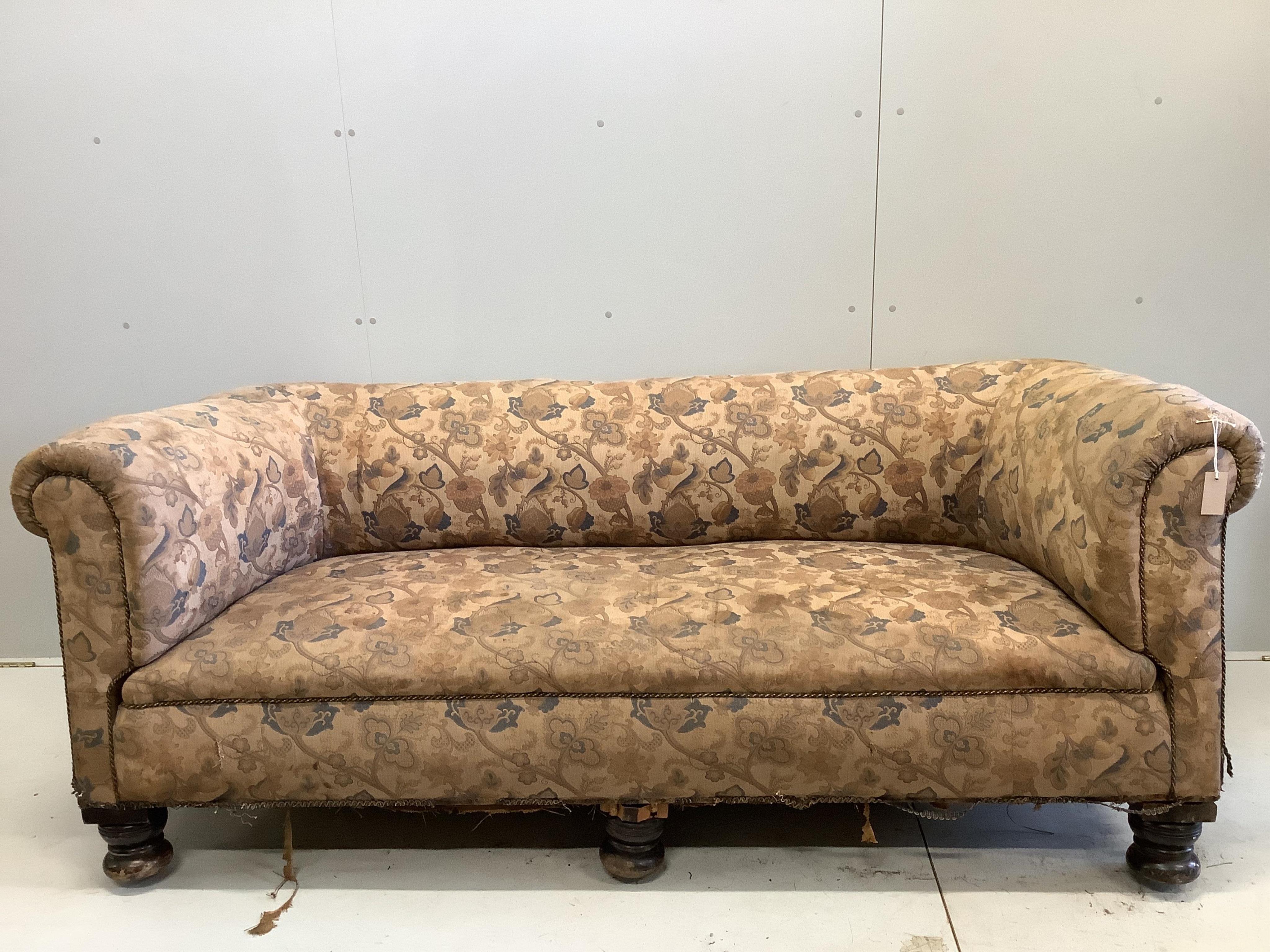 An early 20th century Chesterfield settee, width 208cm, depth 84cm, height 84cm. Condition - poor